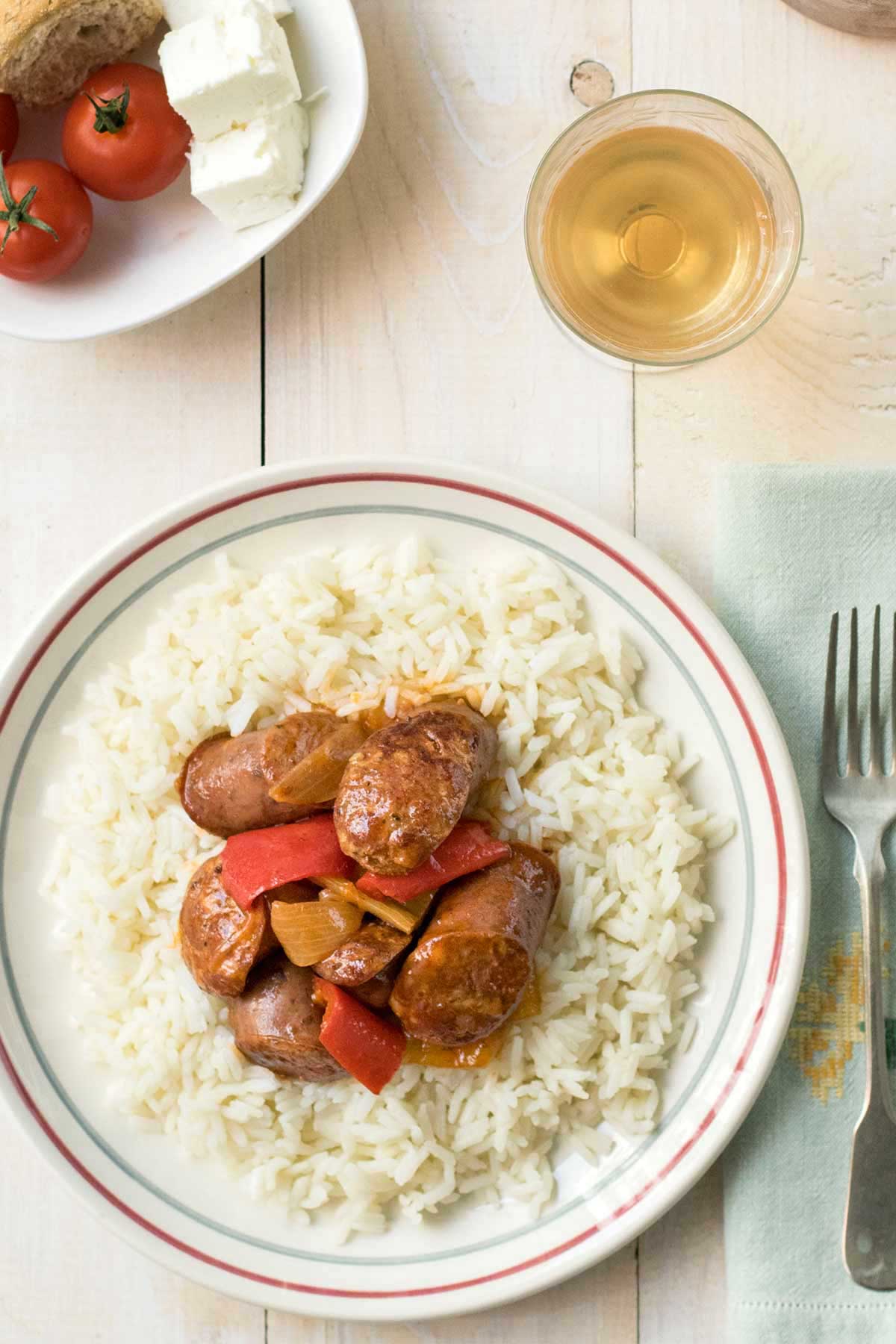 Vertical image of Greek sausage and peppers.