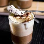 A serving glass with triple chocolate mousse dessert. Featured image.