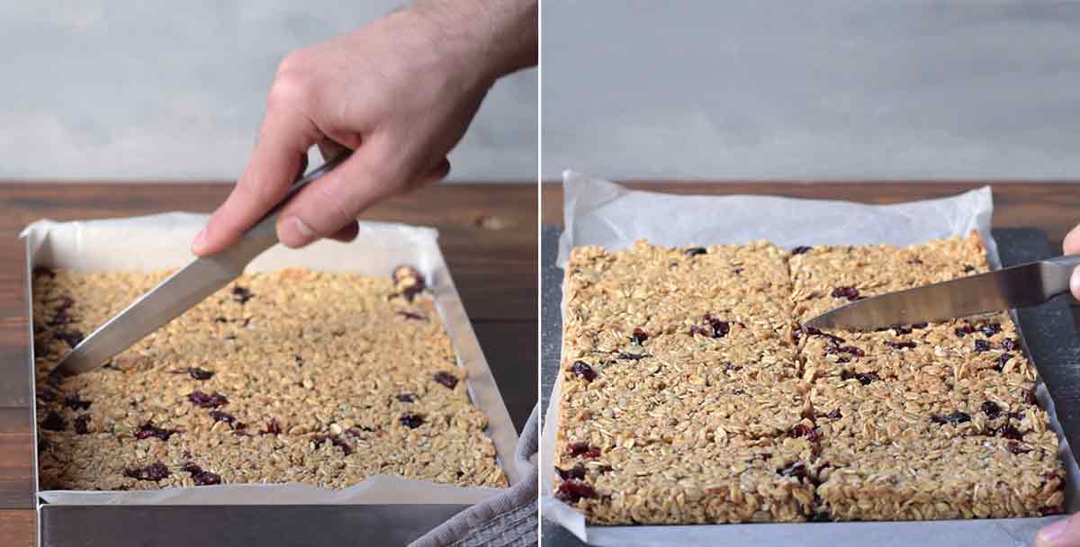 A hand cutting the oatmeal bars with a knife.