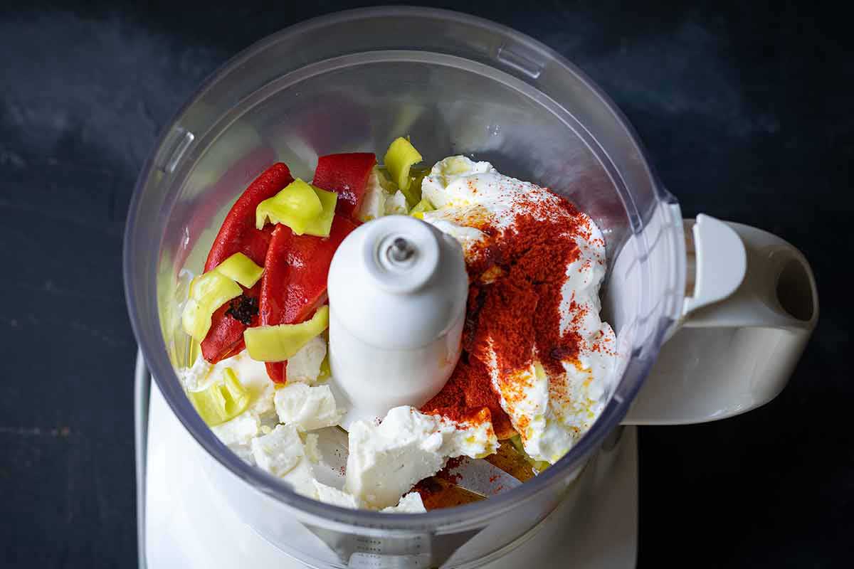 Greek yogurt, feta cheese, roasted red peppers, chili pepper in a food processor.