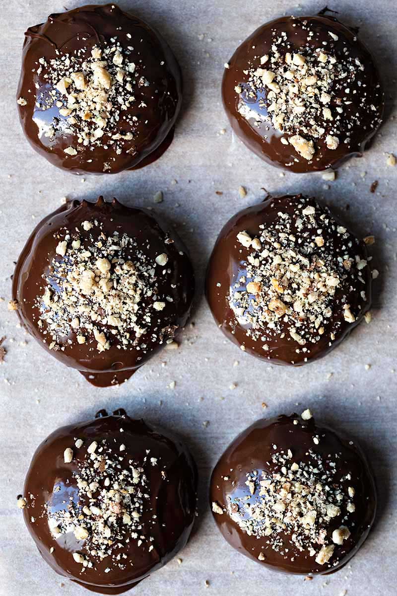 Melomakarona Greek cookies covered in chocolate.