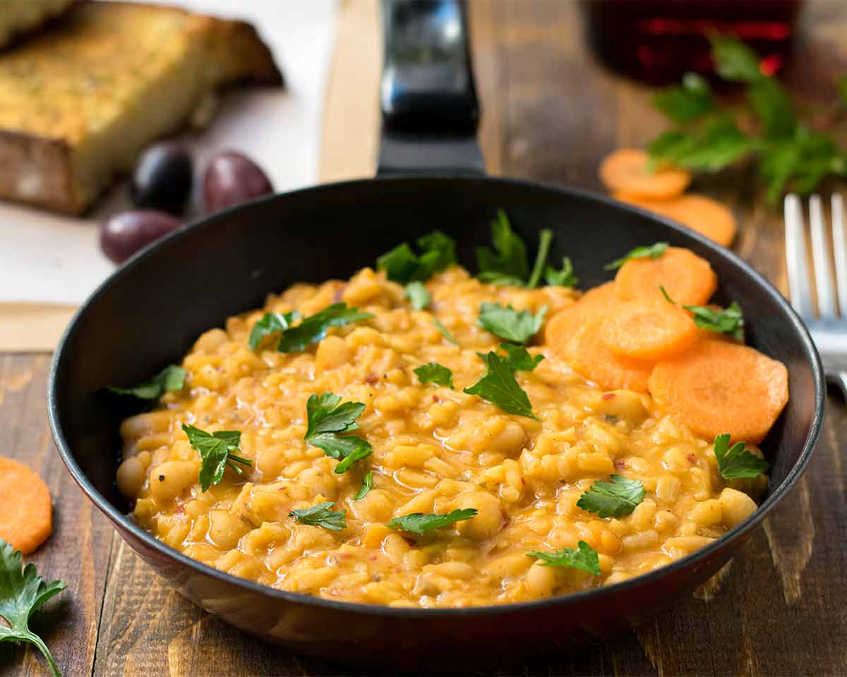 A small saucepan with white bean risotto.