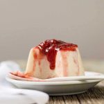 Half-eaten strawberry panna cotta.