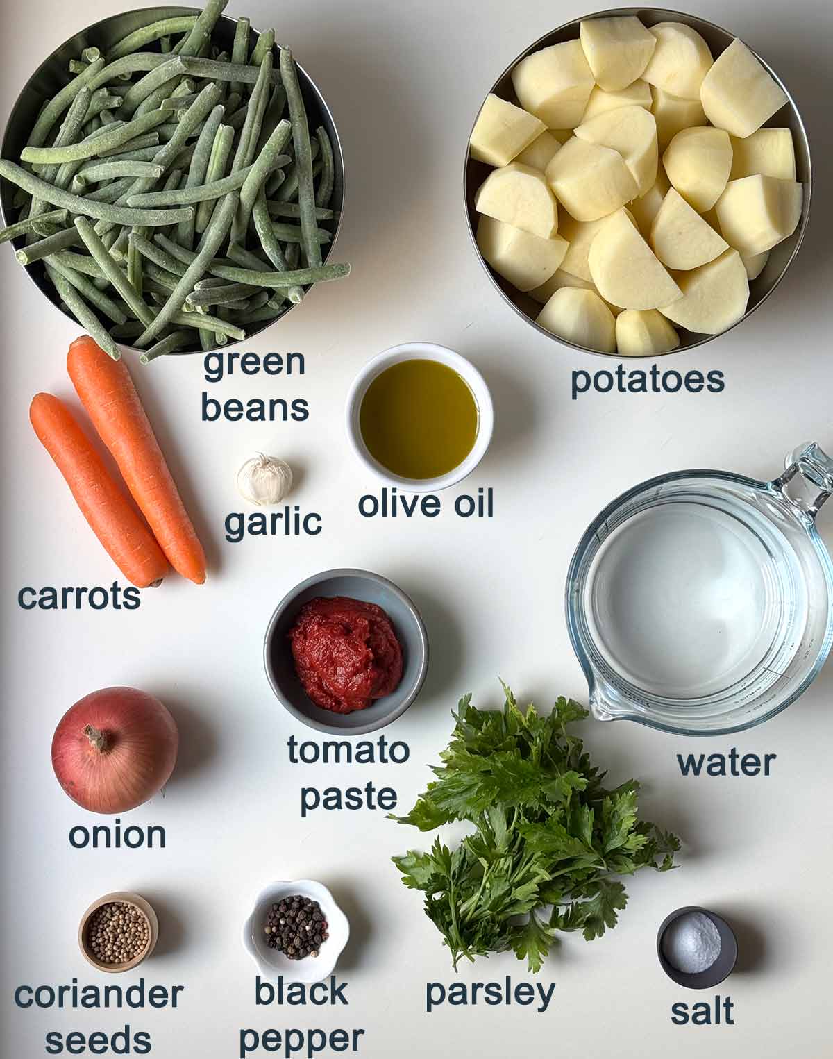 Ingredients for Greek green beans in tomato sauce.