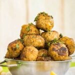 Keftedes - Greek meatballs in a metal bowl.