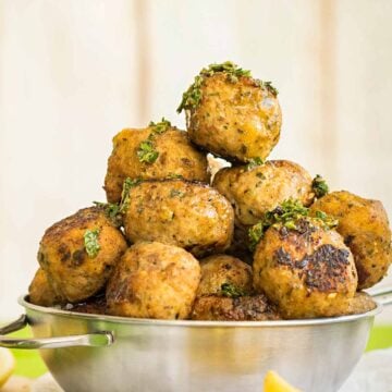 Keftedes - Greek meatballs in a metal bowl.