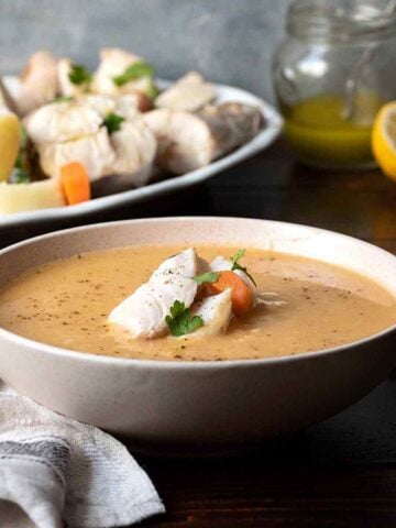 A bowl with Psarosoupa (Greek fish soup).
