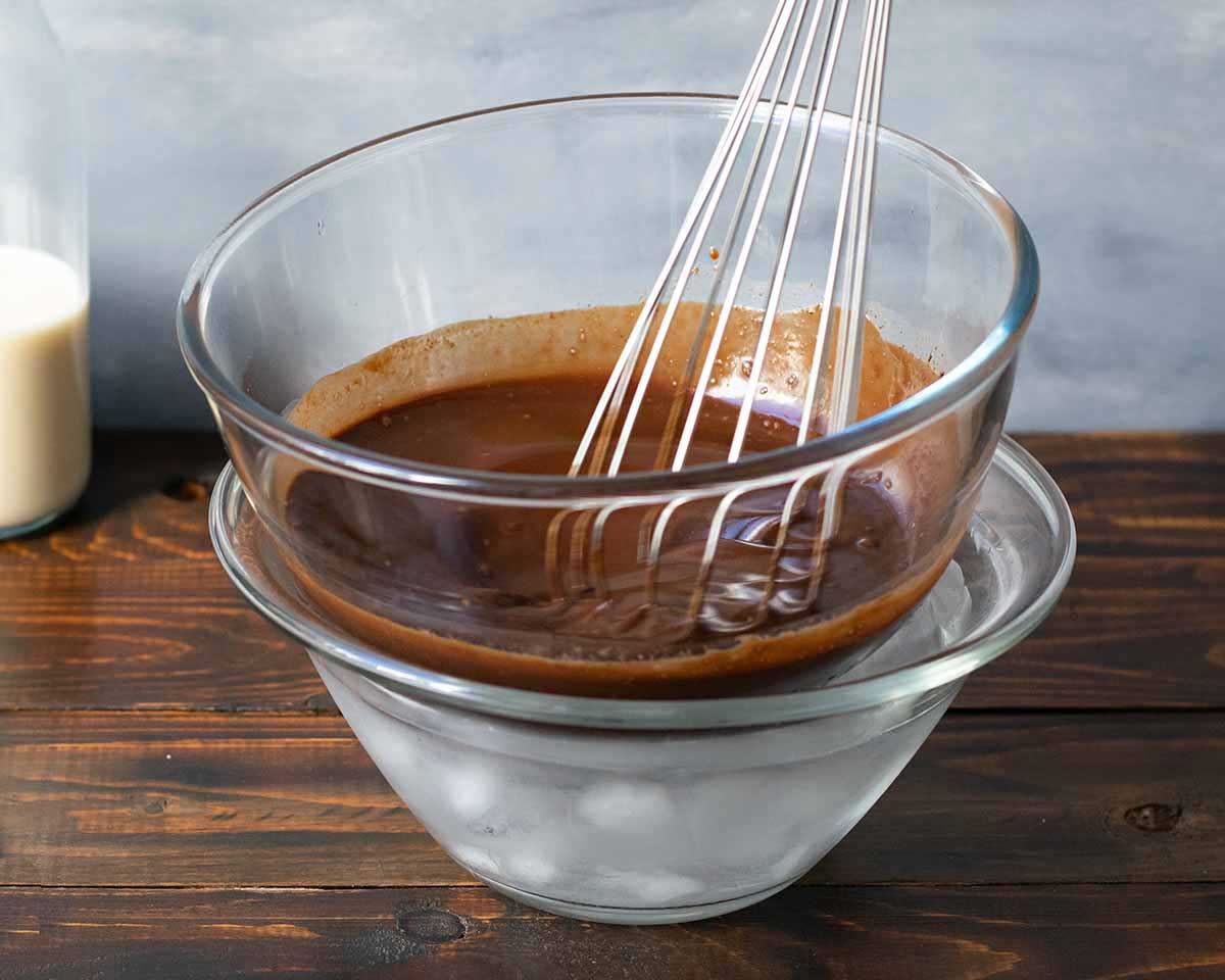 Whipping the chocolate mixture over an ice bath, using a whisk.