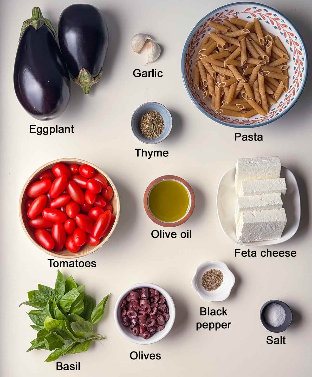 Ingredients for pasta with eggplant, tomato and feta.