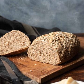 Whole wheat bread on a cutting board.