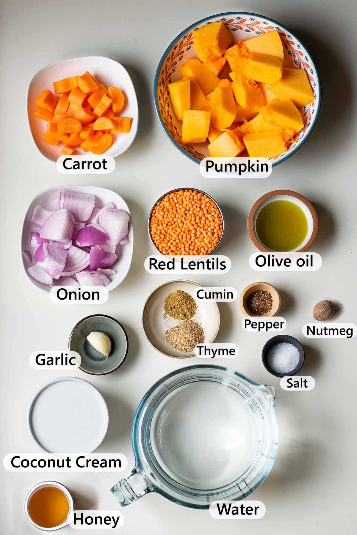 Ingredients required to make vegan pumpkin soup with coconut milk and red lentils.