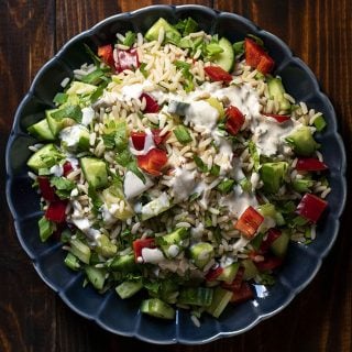Healthy brown rice salad with lemon – tahini dressing feat