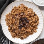 Mujadara with crispy onions in a plate.