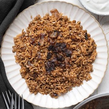 Mujadara with crispy onions in a plate.