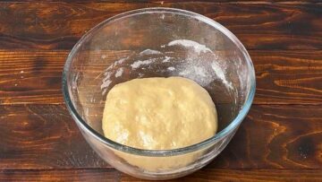 Cinnamon roll dough in a bowl.