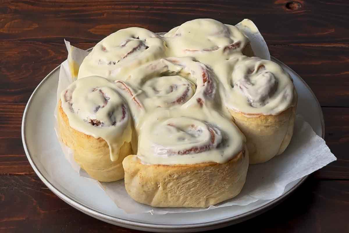 Cinnamon rolls with olive oil and white chocolate icing without cream cheese.