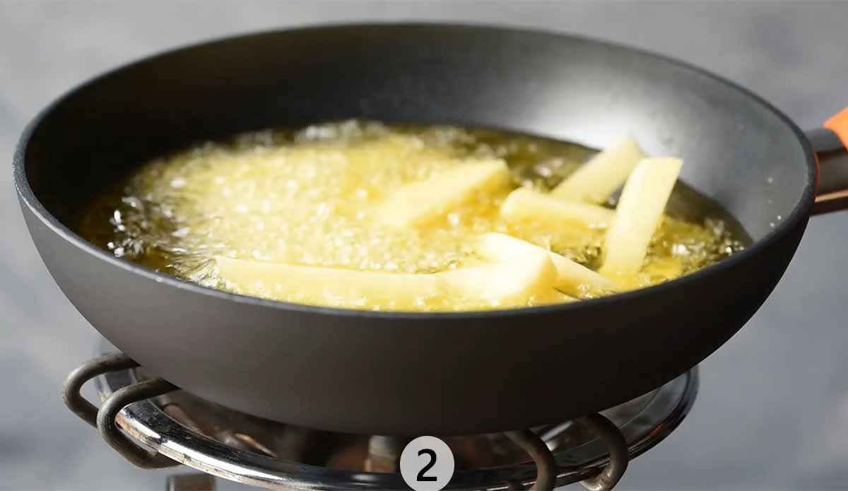 Potato sticks in hot olive oil.