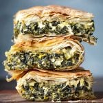 Featured image: 3 slices of spanakopita stacked the one on the other.