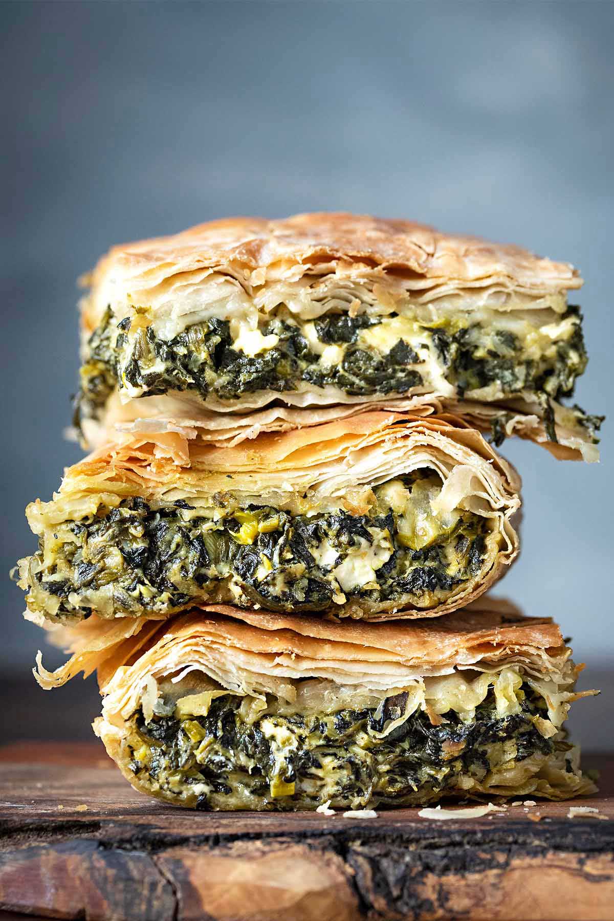 A stack of 3 slices of spanakopita.