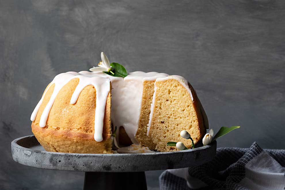 Sliced lemon cake with easy lemon glaze.