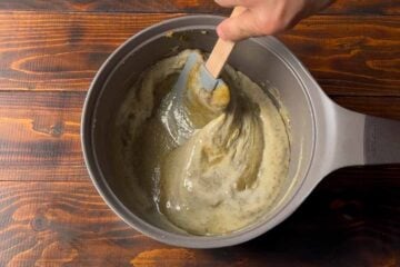 Mixing the sweet condensed milk to the pistachio custard.