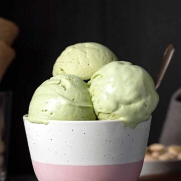 3 scoops of pistachio ice cream in a bowl.