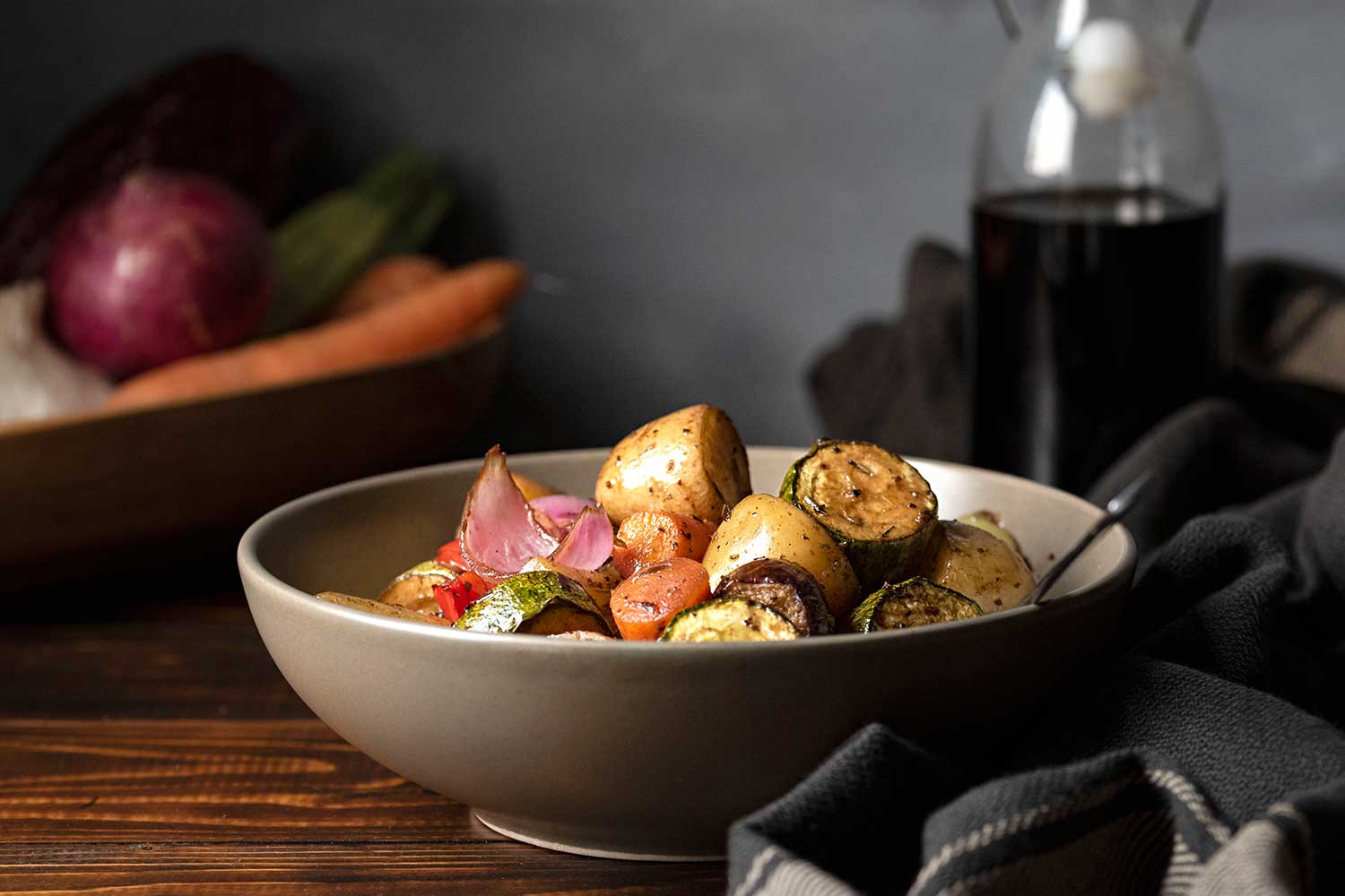 Balsamic glazed roasted vegetables served on a plate.