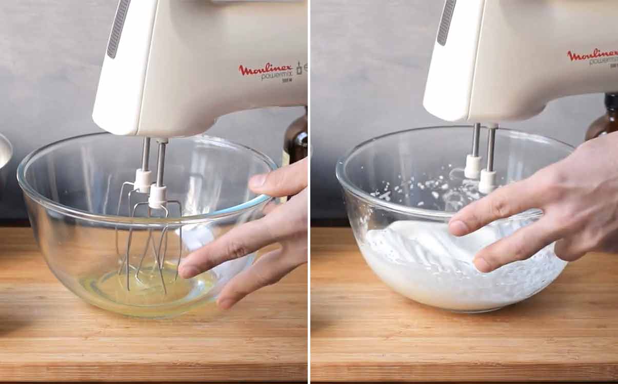 Beating the egg whites with an electric mixer.