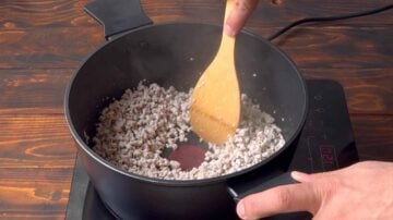 Ground turkey breast inside a pot being cooked.