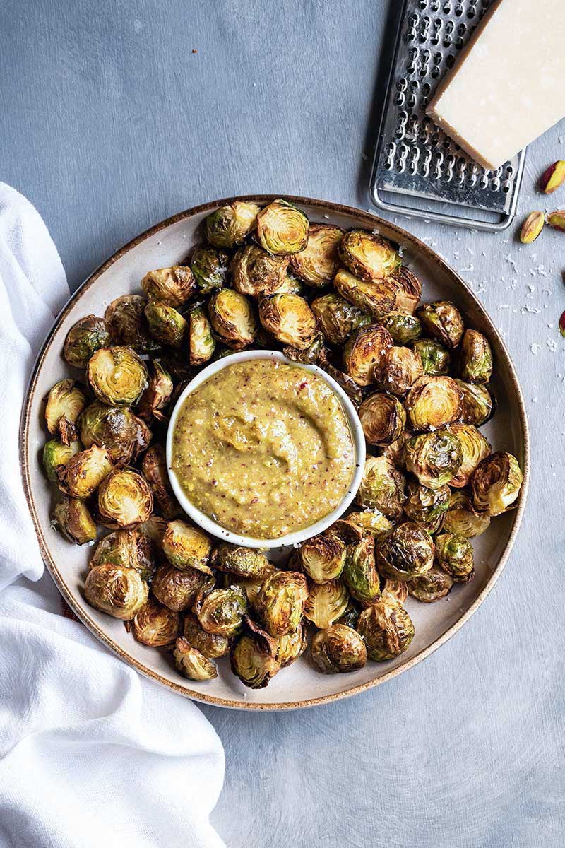 Air fryer Brussels sprouts with garlic parmesan sauce.