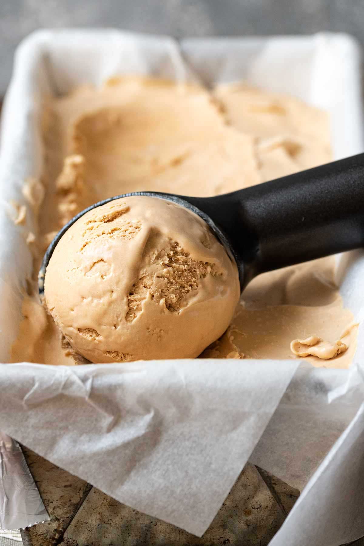 Scooping the coffee ice cream.