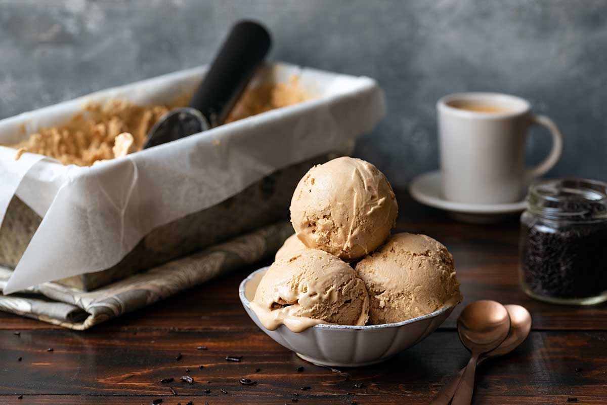 3 scoops of coffee ice cream in an ice cream bowl.