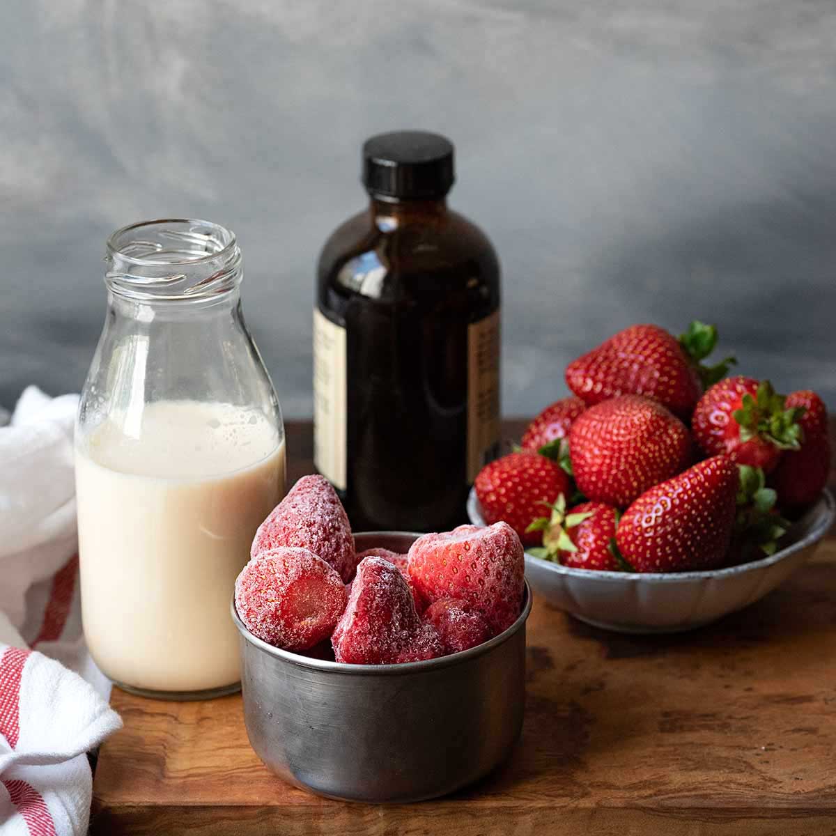 Ingredients for strawberry milkshake.