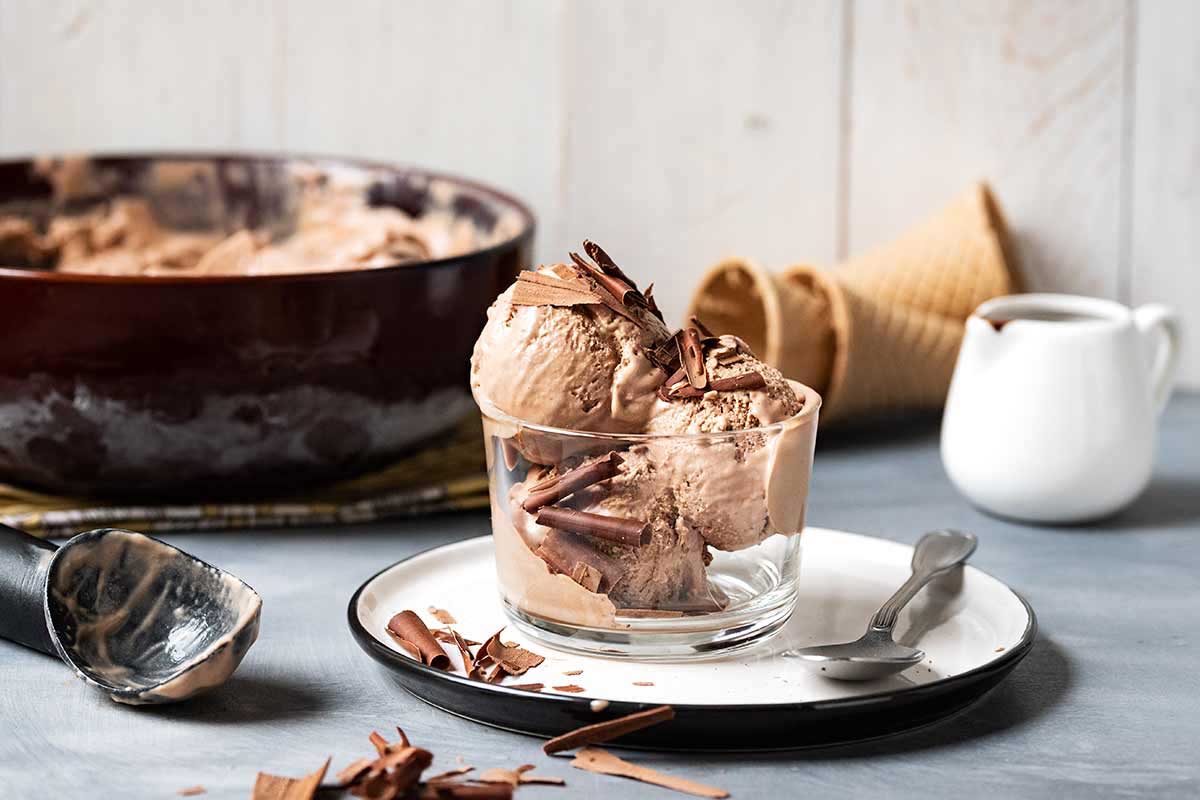3 scoops of coffee chocolate ice cream served in a bowl with dark chocolate shavings.