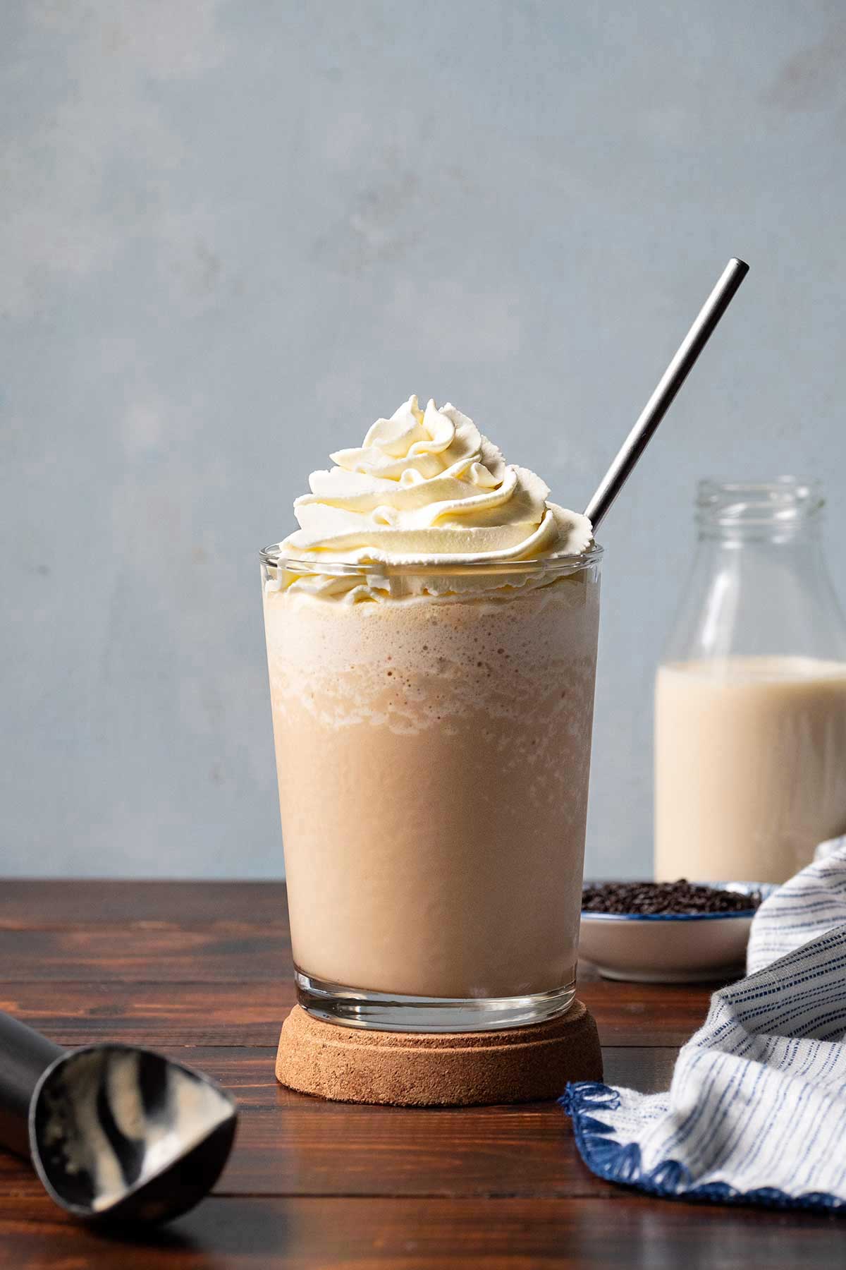 Homemade frappuccino with ice cream, garnished with whipped cream.