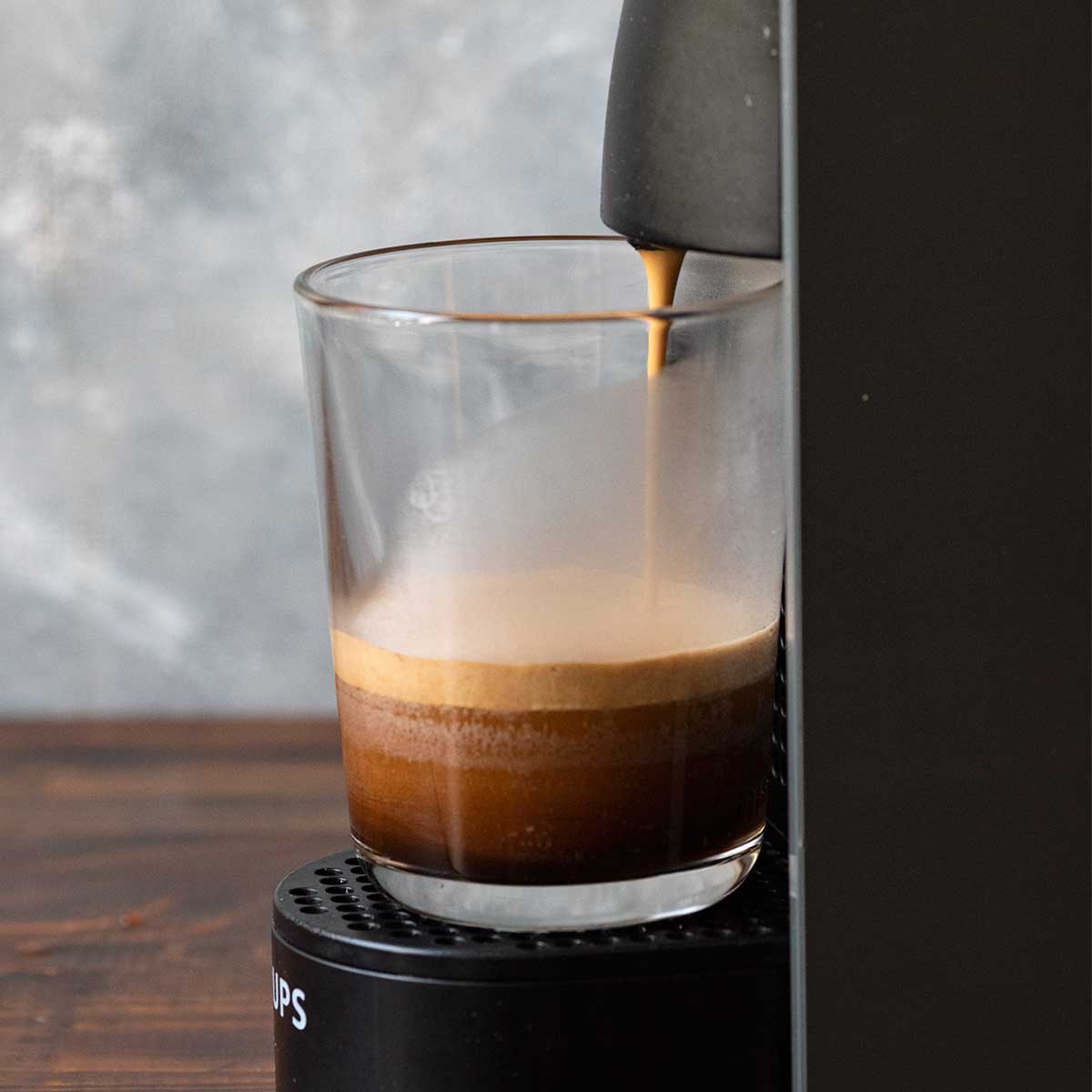 Brewing espresso with an espresso machine.