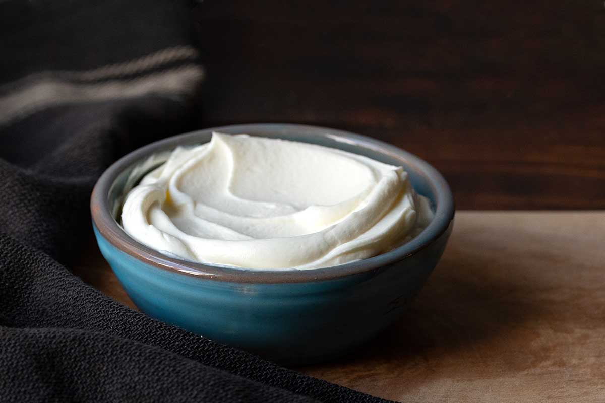 Image showing a bowl of creme fraiche as a dairy Greek yogurt substitute.