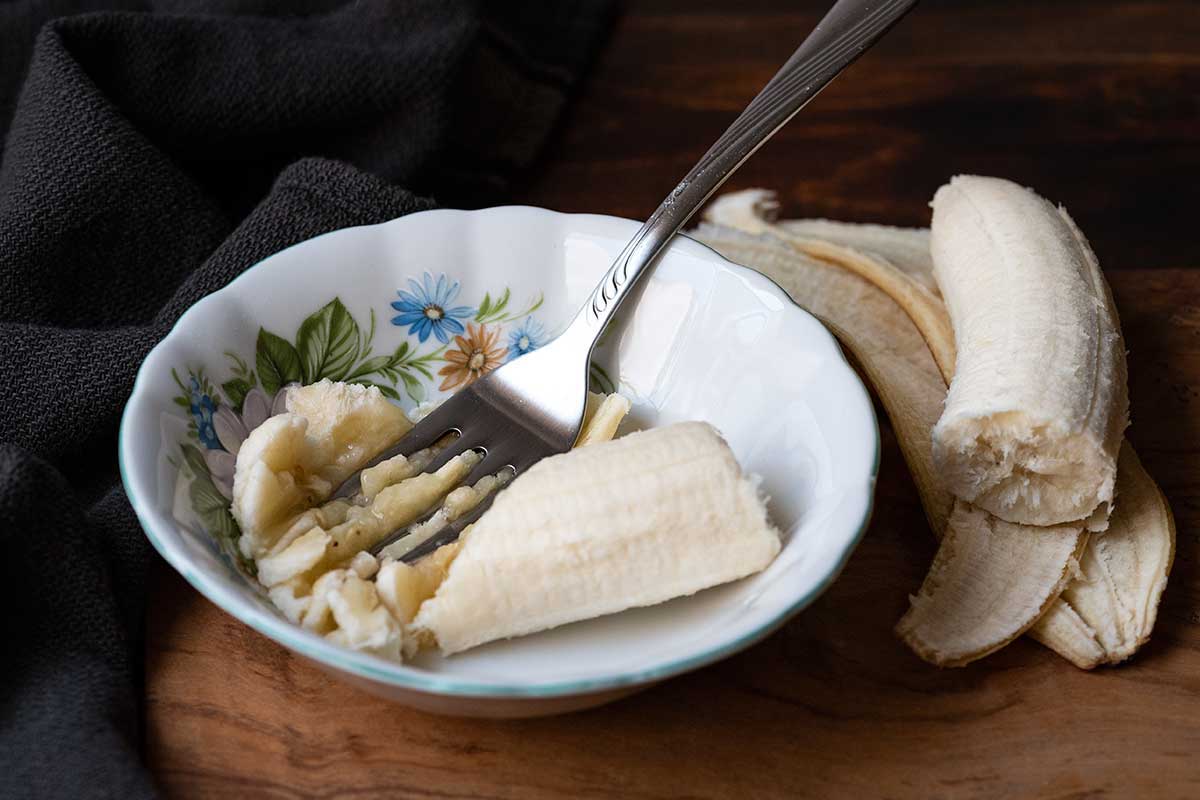 Image showing mashed banana as a dairy-free Greek yogurt substitute.