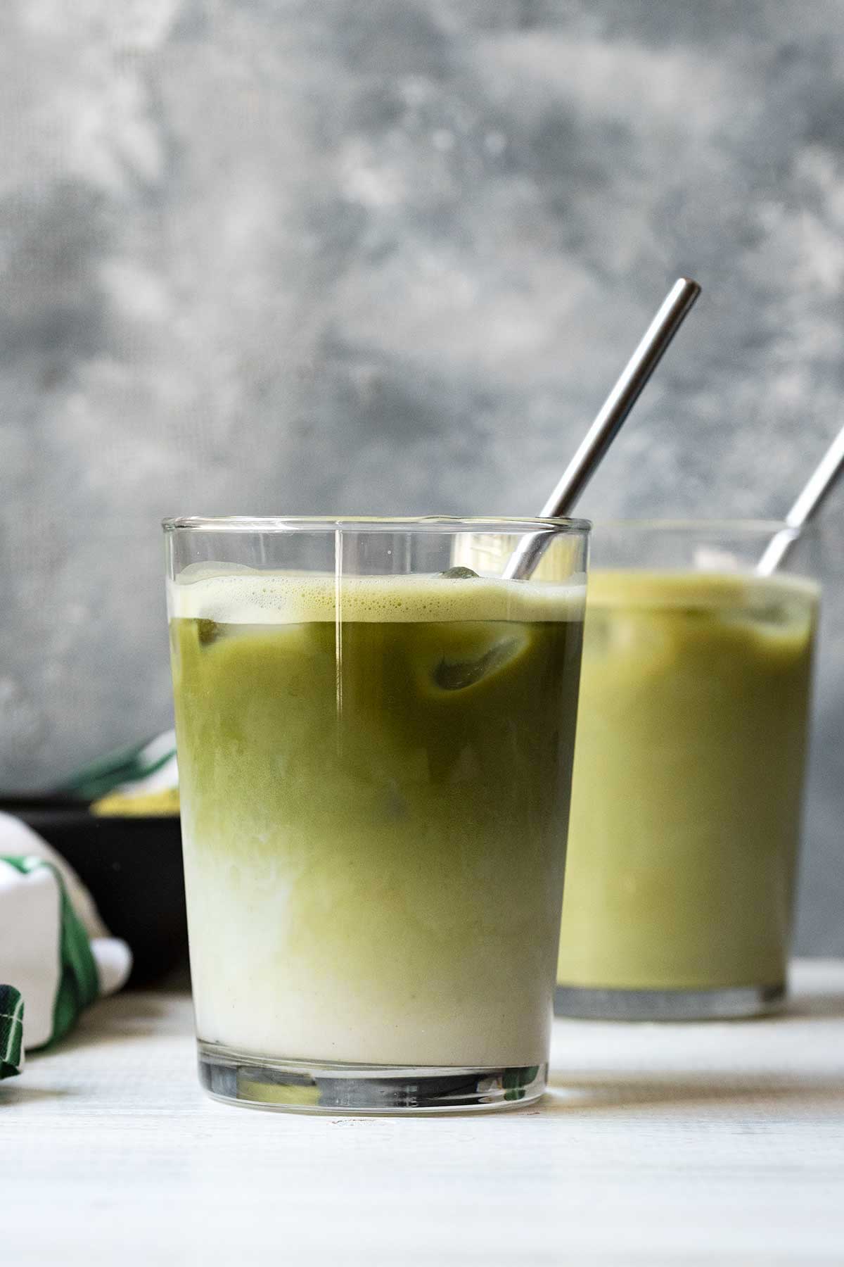 2 glasses with iced matcha latte