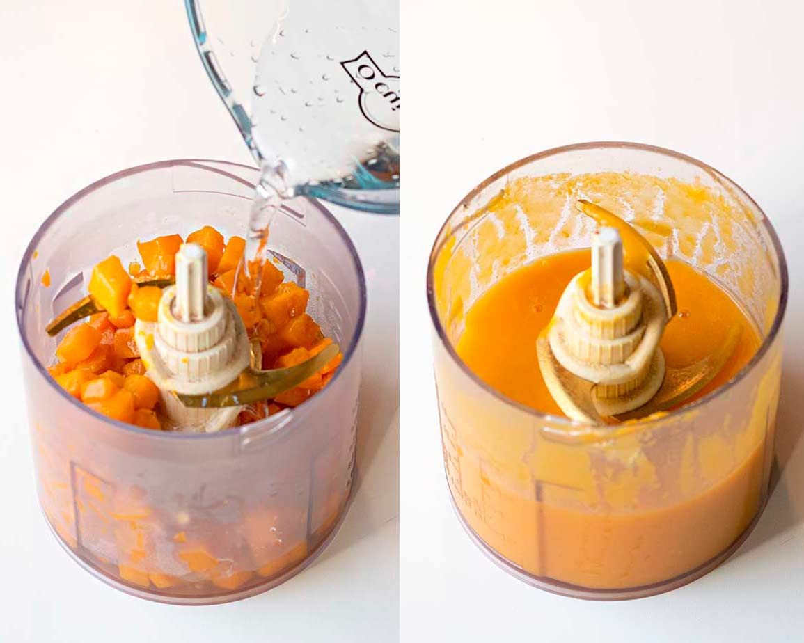 Cooked pumpkin cubes in a food processor.