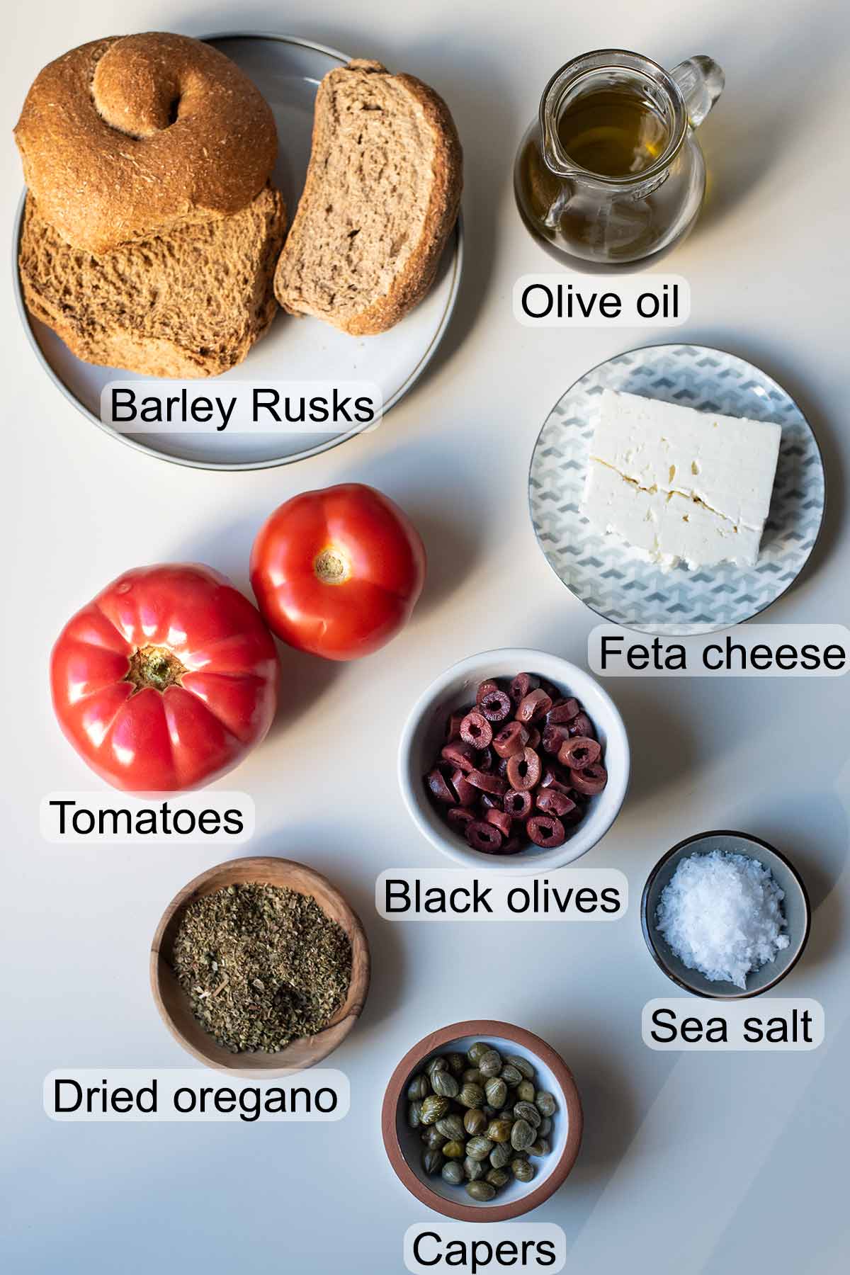 Ingredients to make a Cretan dakos salad.