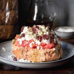 Cretan dakos salad on a plate.