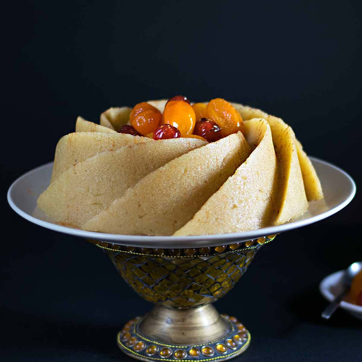 A semolina halva cake on a cake platter.