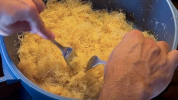 Toasting the kataiifi pastry in a pot with butter.