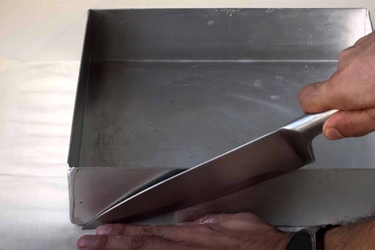 Cutting the phyllo sheets the size of the baking pan.