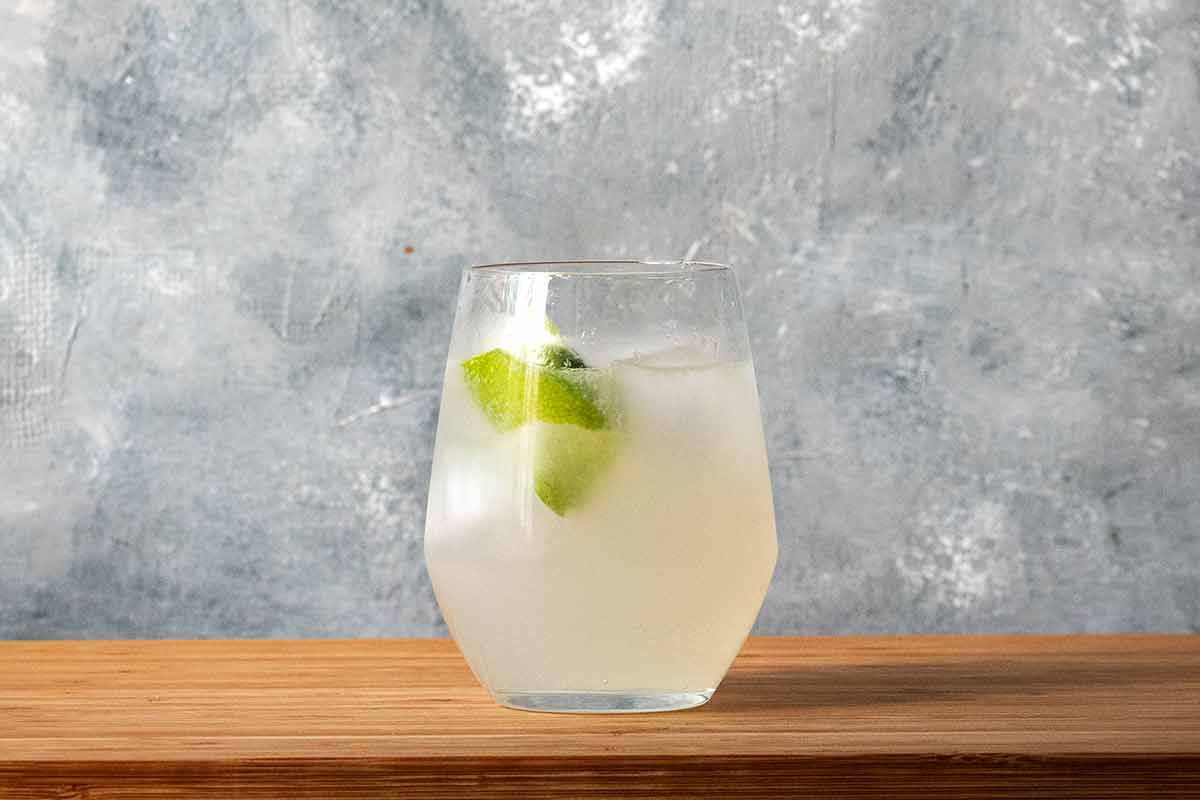 A glass with ouzo, lime and mastic liqueur.