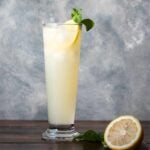 A glass with ouzo lemon drink.