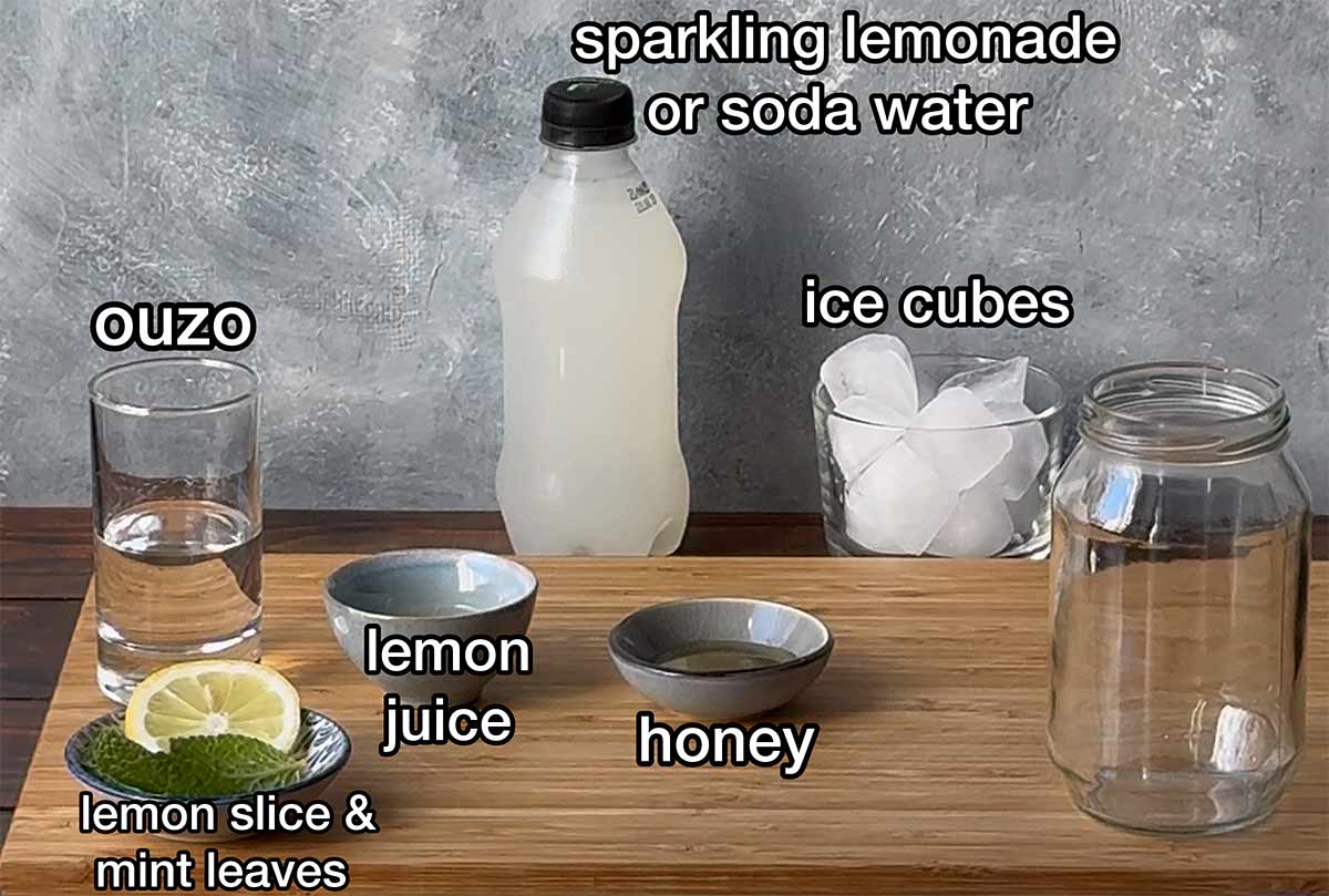 Ouzo lemon drink ingredients with labels.