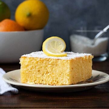 A piece of Revani cake on a plate.