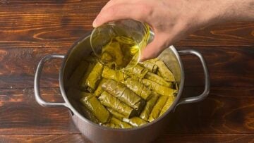 Dolmades inside a pot.